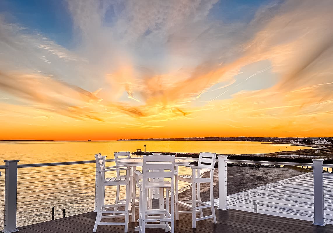 Falmouth Tides roof deck at sunset
